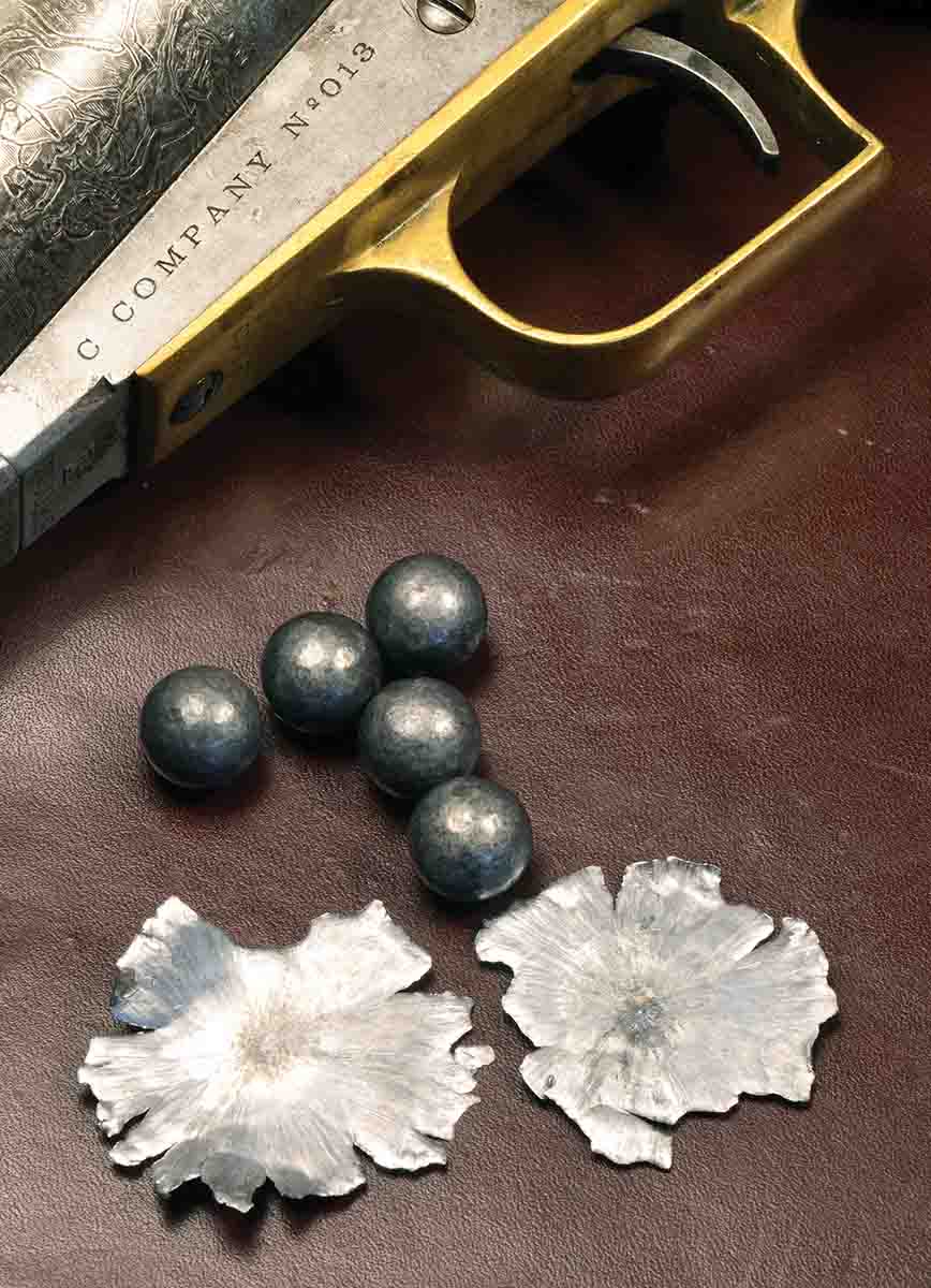 A Hornady 140-grain lead ball from the .44 (.454 inch) Walker carries a lot of power. The flattened balls were fired against a steel plate at 15 yards.